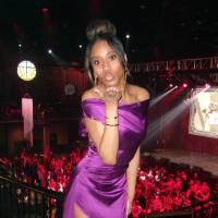 Person wearing a dress and blowing a kiss to the camera